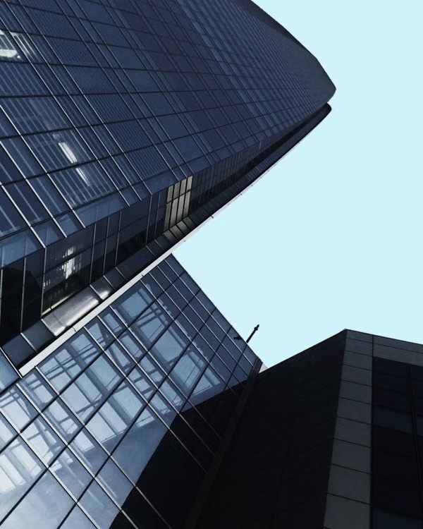 Looking up at the tower's glazing against the sky